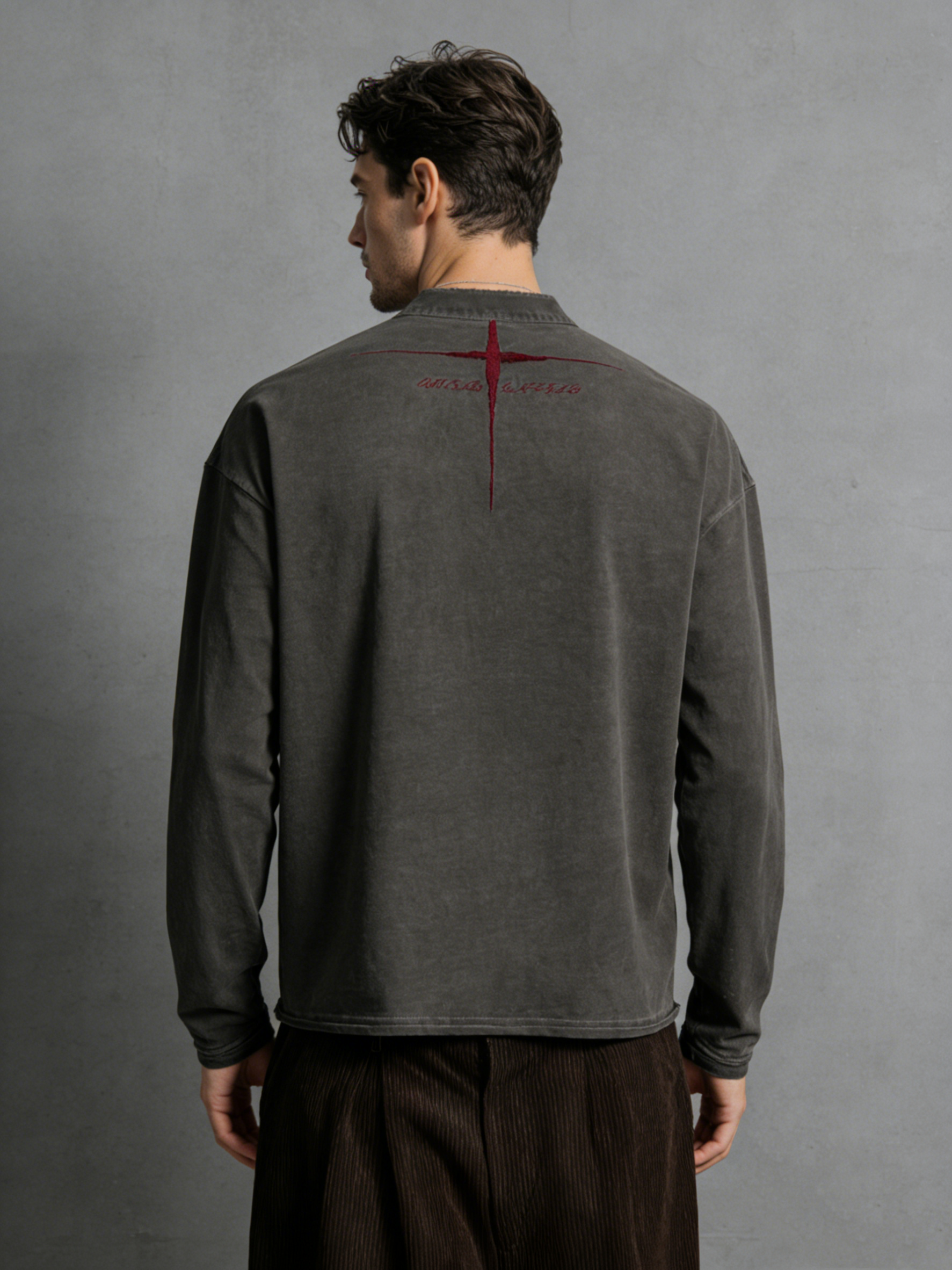 Embroidered long-sleeved top with frayed edges