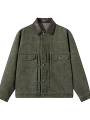 Washed, distressed denim jacket featuring color accents, pleated detailing, a lapel collar, and a loose fit.